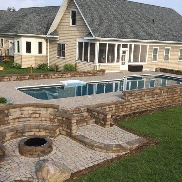 In-ground pool with fire pit area