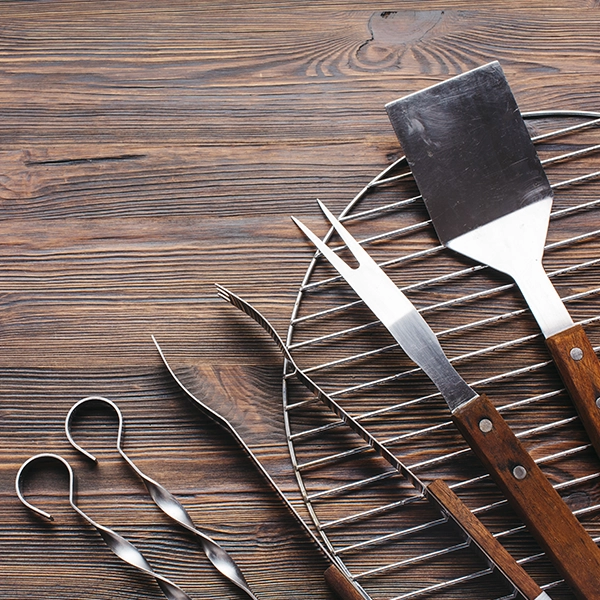 Grilling Tools on Wooden Table
