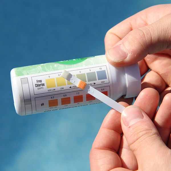 man holding water test strip